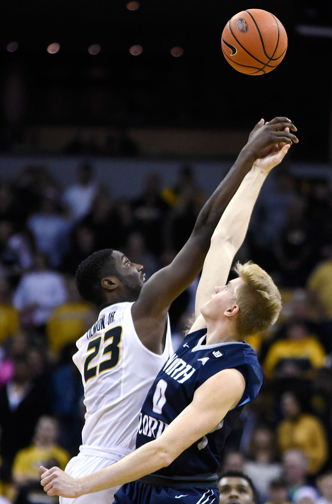 Jeremiah Tilmon fights with North Florida forward Noah Horchler for possession
